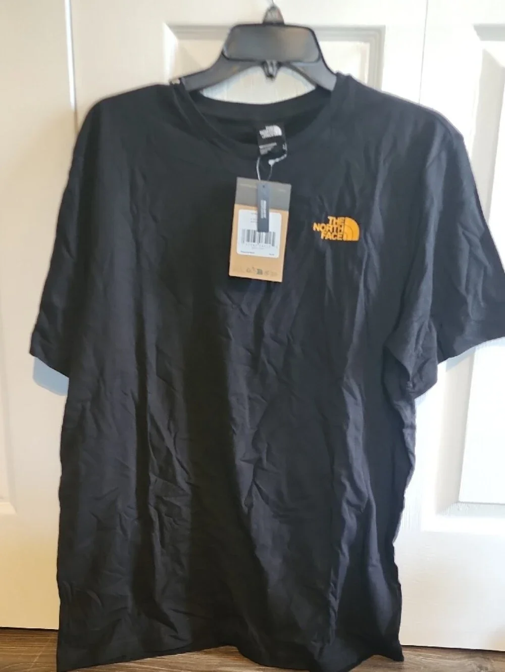 The North Face Men’s Black Short Sleeve Graphic Tee with Yellow Accent